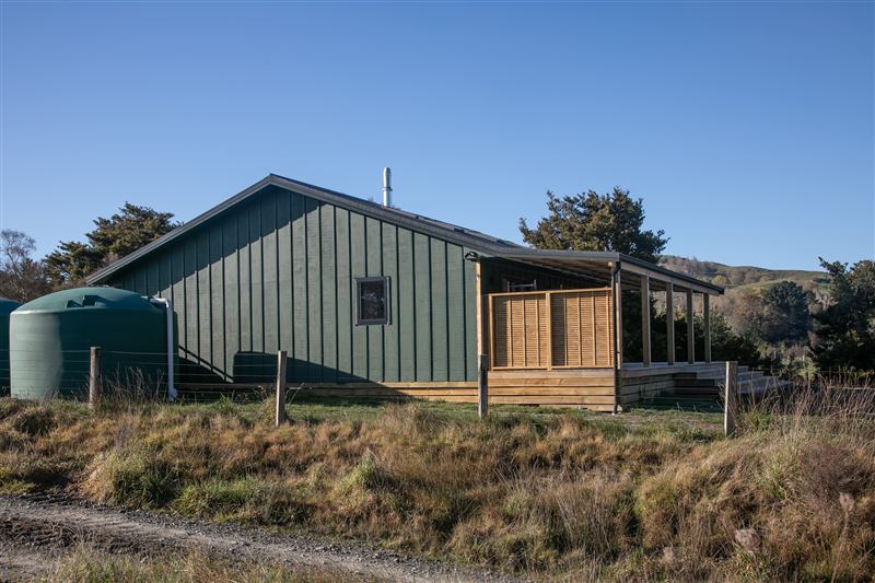 Farm cabin with a timber deck