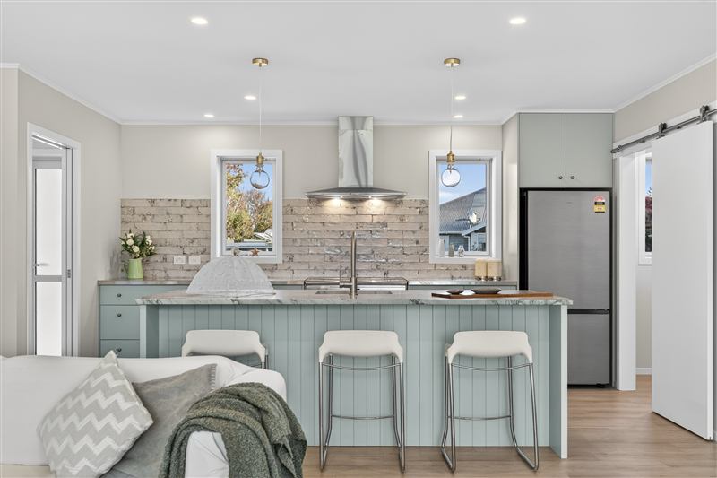 Kitchen island with green cabinetry