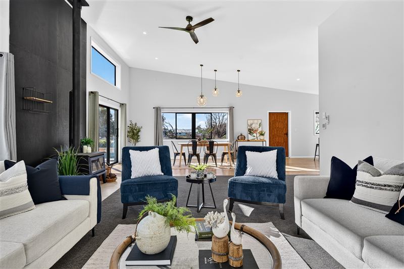 Open-plan living room with a vaulted ceiling