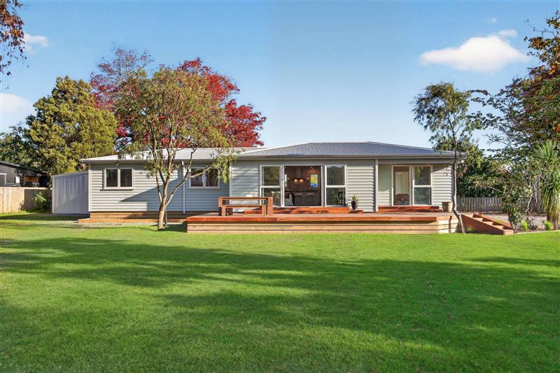 Renovated home seen from the back lawn