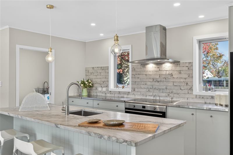 Renovated kitchen with a stone benchtop