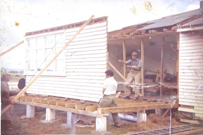 An early Johnson Brothers Building project, house on piles under construction